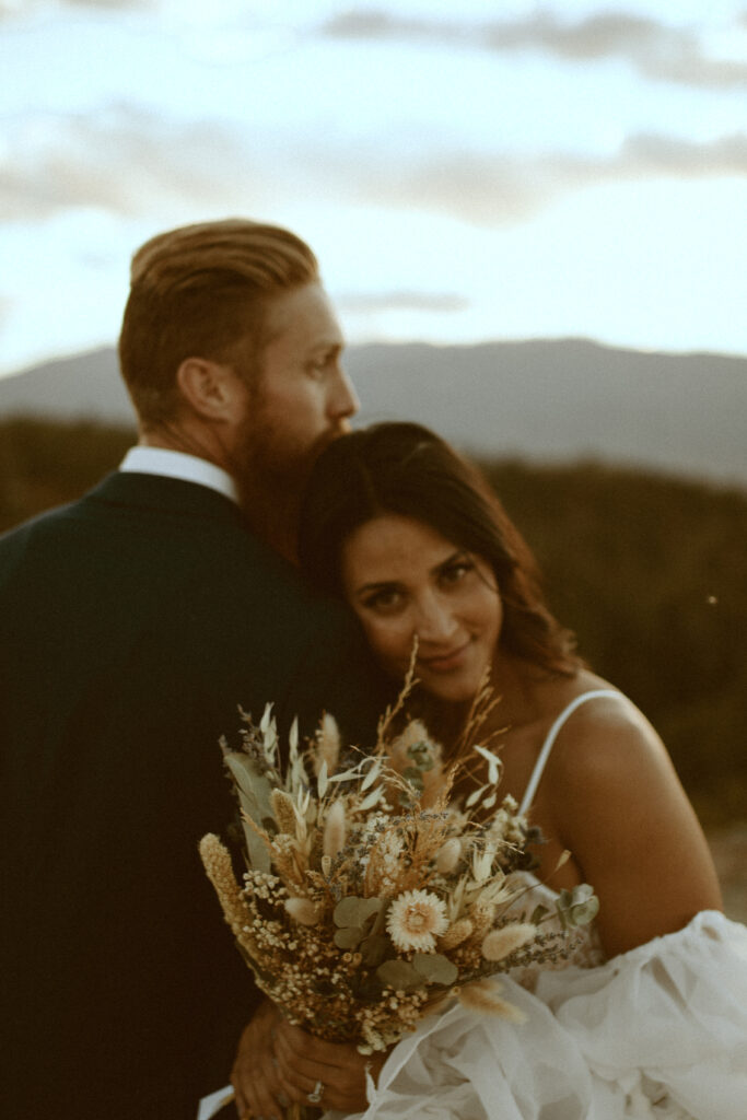 intimate Colorado Elopement overlooking Pike Peak in beautiful Colorado Springs. Blue Mountain Tone Wedding inspiration.Mountain top Elopement. Dried Floral Wedding Bouquet. 