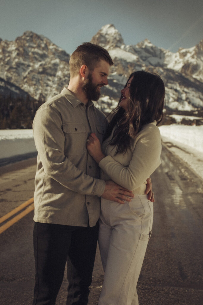 Grand Teton Couples Mini session in Jackson Hole Wyoming location Windy Point Turnout. Jackson Hole Photographer. Vacation Photoshoot in Grand Teton National Park for memories.