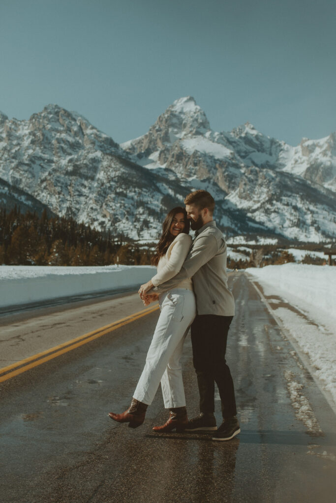 Grand Teton Couples Mini session in Jackson Hole Wyoming location Windy Point Turnout. Jackson Hole Photographer. Vacation Photoshoot in Grand Teton National Park for memories.