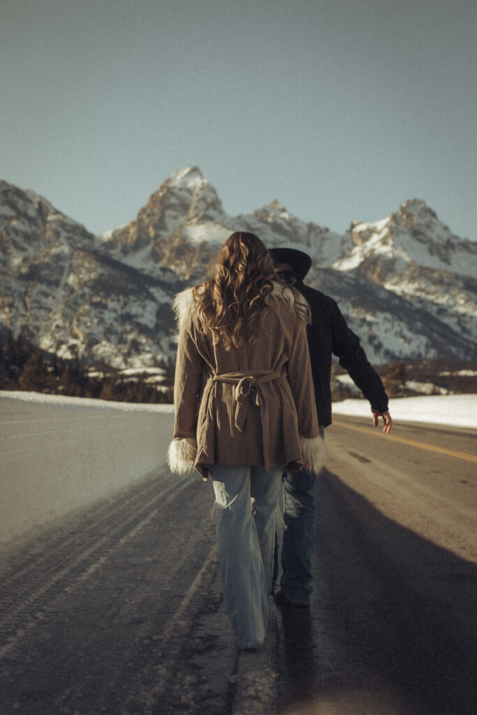 Jackson Hole Wyoming Engagement photos in front of the Tetons. Western couple in Jackson Hole Wyoming. Grand Teton elopement photographer. Jackson Hole Elopement Photographer. Windy Point Turnout photos in Grand Teton National Park