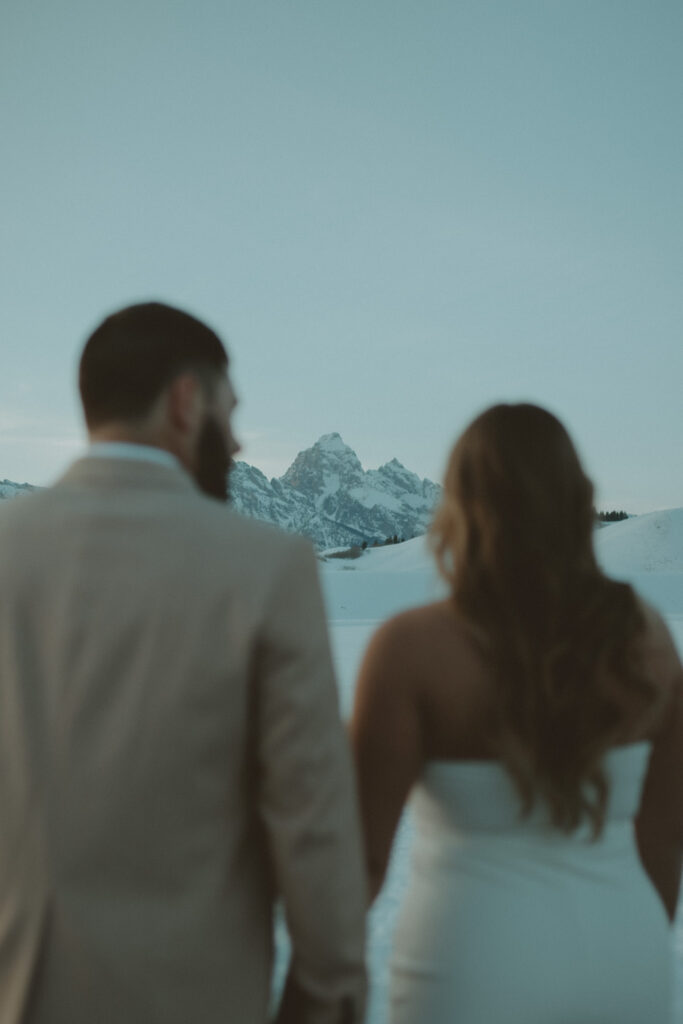 Jackson Hole Wyoming Engagement photos in front of the Tetons. Western couple in Jackson Hole Wyoming. Grand Teton elopement photographer. Jackson Hole Elopement Photographer. Windy Point Turnout photos in Grand Teton National Park