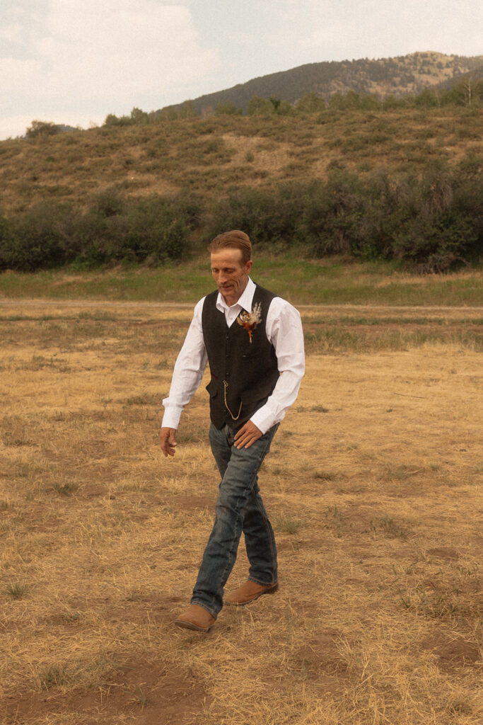 groom walking down the aisle for his wedding ceremony