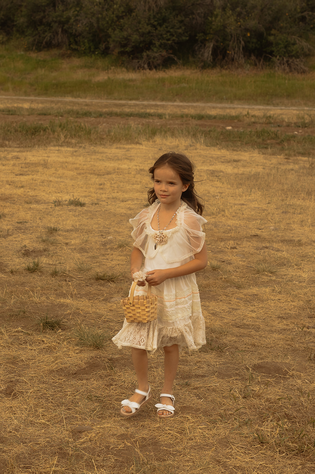 flower girl walking down the aisle for the wedding ceremony