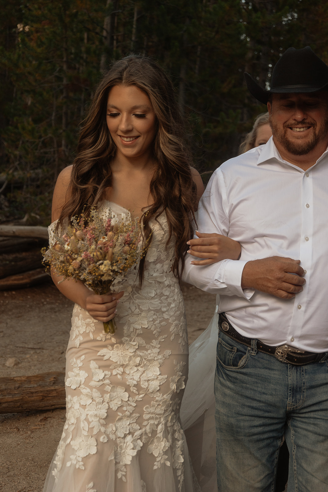 bride walking down the aisle for her elopement at taggart lake